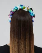 Rear view of the Maria Blueberry Headband worn by a woman, focusing on the headband's fit and the patterned fabric