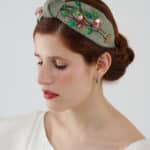 Elegant Greenery Headband hand-embroidered with green leaves, pink flowers, and sequins, displayed on a model wearing the Maria Jasmine Mini Dress.