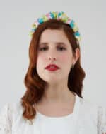 "Frontal view of a woman wearing the Tulip Headband, featuring pastel silk devoré fabric with a ruched design, paired with the elegant Maria Lily Mini Dress."